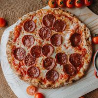 Canadese Pepperoni Pizza with rustic tomato sauce, fresh mozzarella, and savoury pepperoni